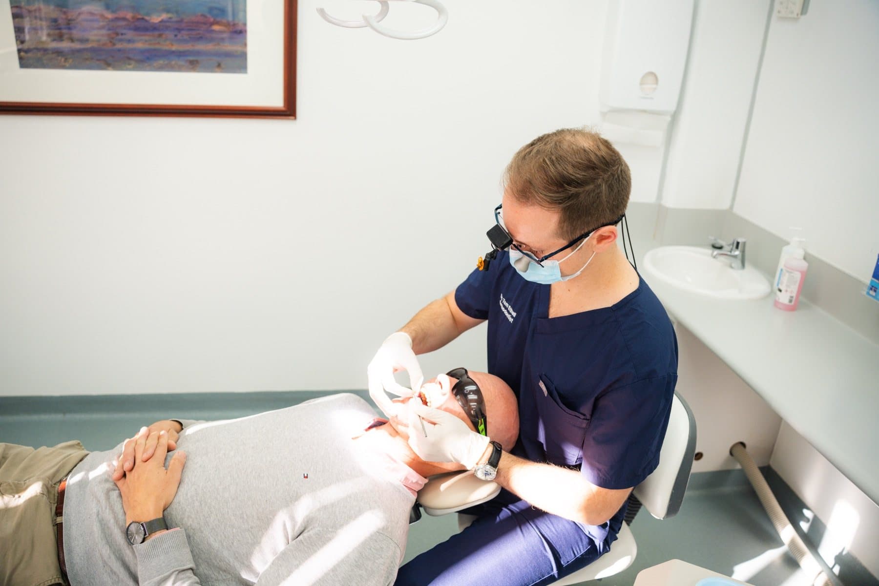 Clinician and patient reviewing intraoral scan on a monitor